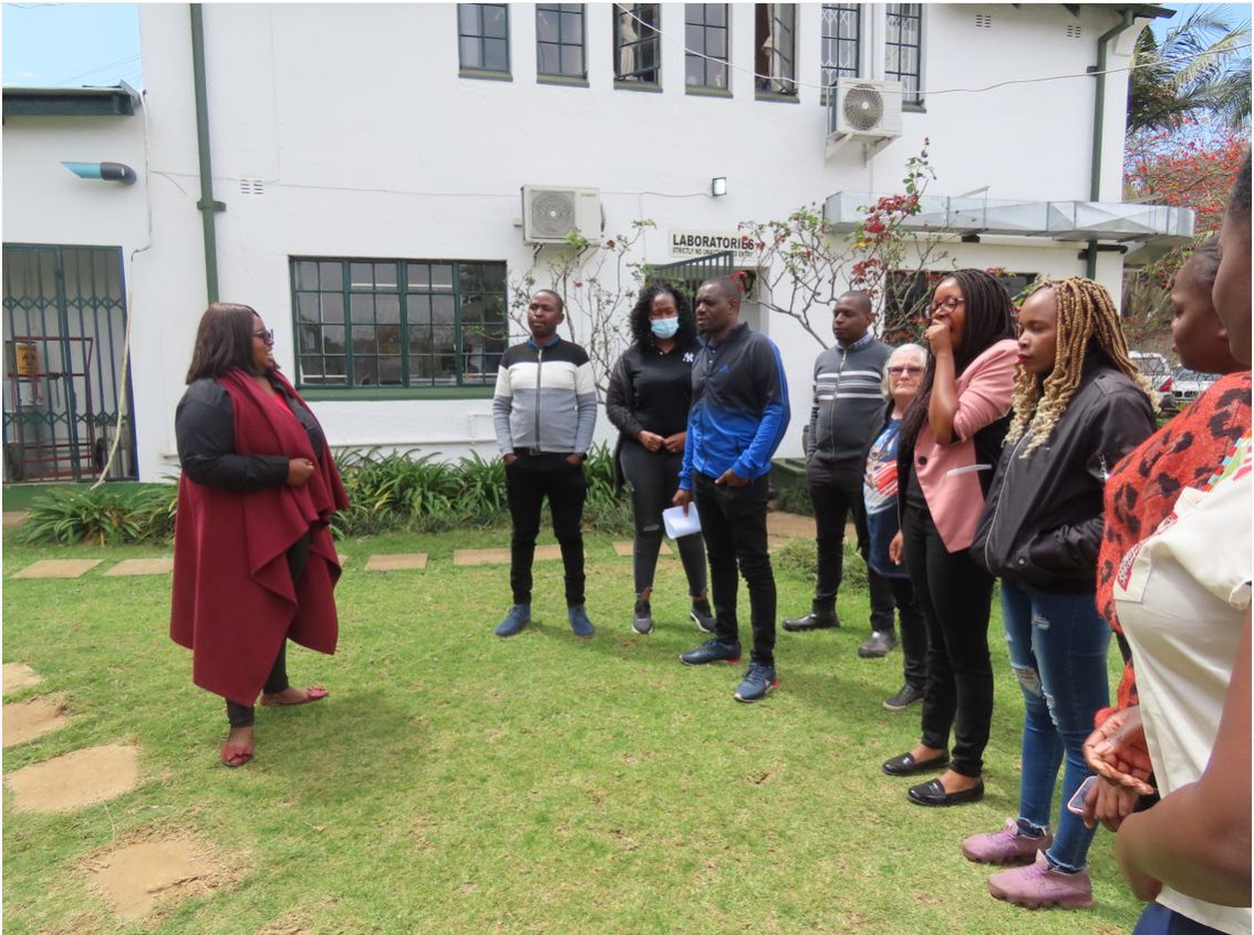 Researchers gathered outside the BRTI laboratories in Harare