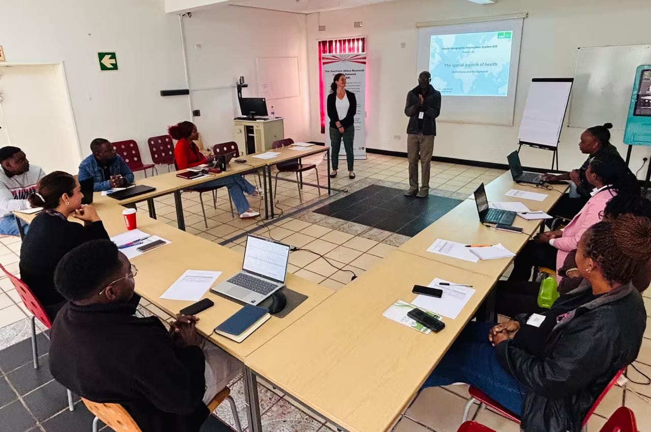 Researchers in a SOFAR training session on the spatial aspects of health